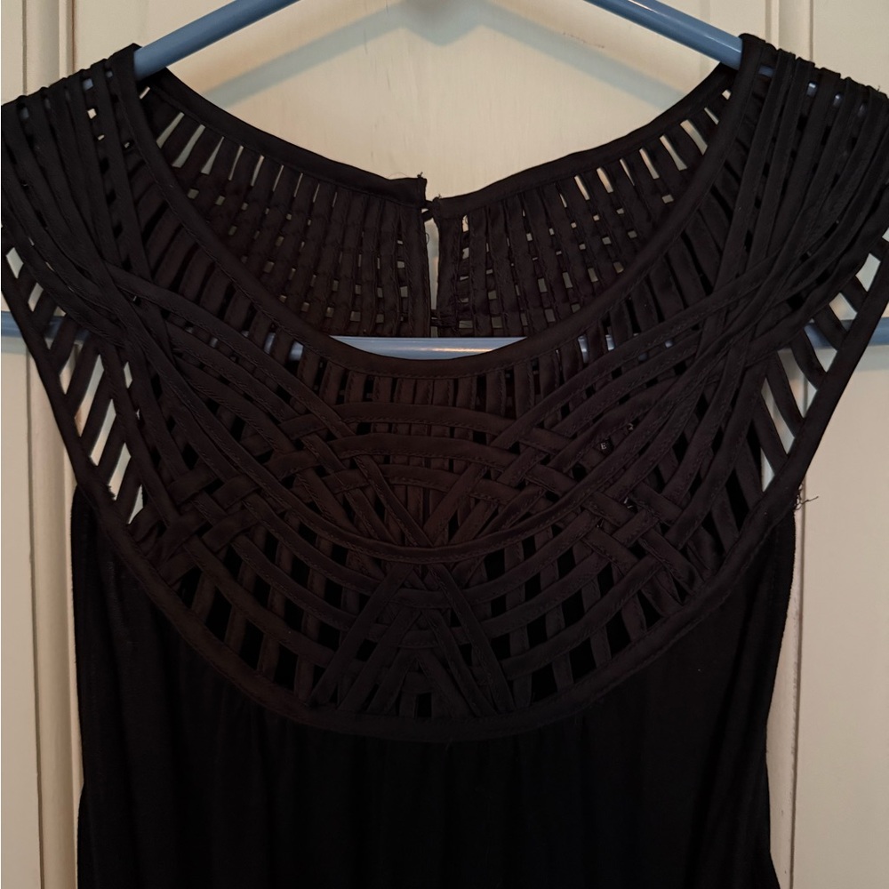 Black Sleeveless Top with Intricate Neckline